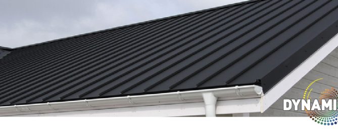 Dark gray corrugated metal roof panels on a residential home, Dynamix product branding visible.