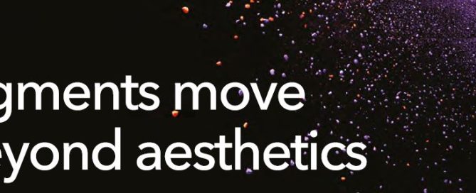 Bold text 'Pigments move beyond aesthetics' with colorful particles streaming across a dark background.