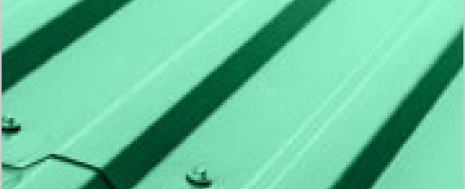 Angled close-up of light green corrugated metal roofing showing ridged texture and shadow detail.