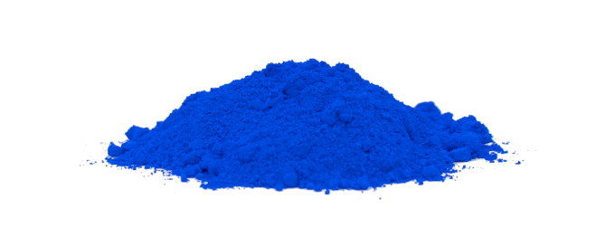 Mound of bright blue pigment powder against a white background showing vivid, saturated color.