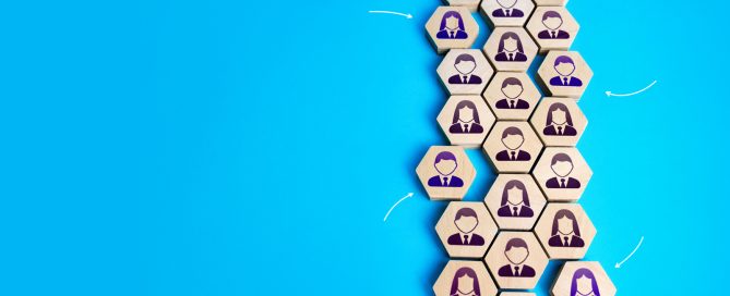 Diverse team of professionals posed together in a business setting representing an inclusive workforce.