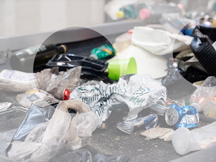 Plastic waste on a conveyor belt in a waste management plant