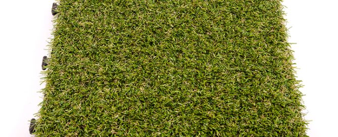 Bright green artificial turf mat sample showing dense, uniform synthetic grass fibers.