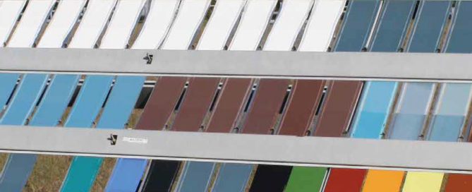Color palette of horizontal paint or coating sample rows in whites, grays, blues, reds, browns, and blacks showing durability testing.