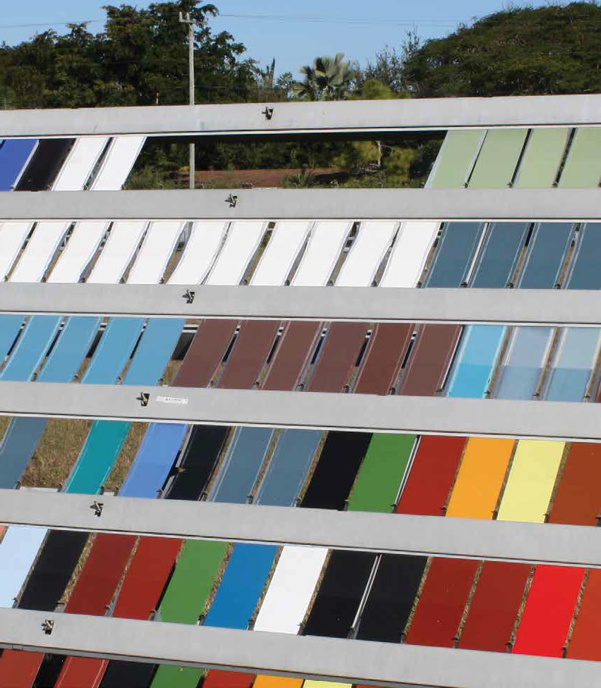 Color palette of horizontal paint or coating sample rows in whites, grays, blues, reds, browns, and blacks showing durability testing.