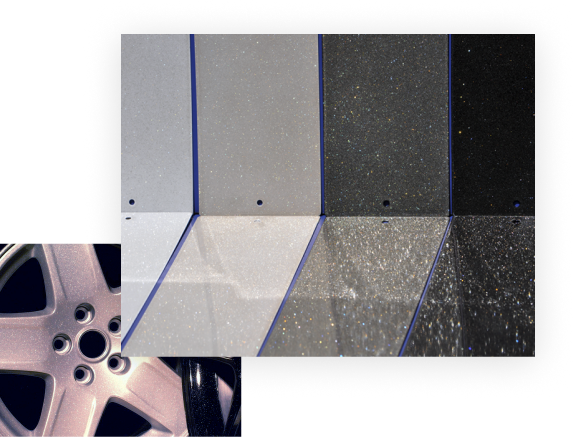 Car wheel hubcap with metallic silver and dark gray finishes, demonstrating pigment use in automotive coating applications.